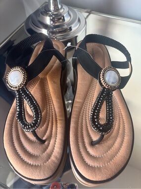 Wanderlust Black Beaded T-Strap Sandals with Decorative Medallions